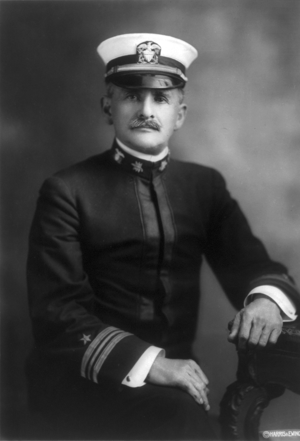 Formal portrait photograph of Albert A. Michelson in 1918, in a dark suit, facing slightly left